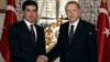 FILE - Turkey's President Recep Tayyip Erdogan, right, and Prime Minister of Iraq's autonomous Kurdish region Nechirvan Barzani shake hands before a meeting in Istanbul, Nov. 23, 2016. 
