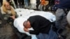 Mourners react next to the bodies of Palestinians killed in an Israeli strike in Rafah in the southern Gaza Strip, Jan. 18, 2024. 