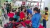 In this handout photo provided by the Philippine Red Cross, volunteers attend to people affected by an earthquake that struck General Santos City, South Cotabato, southern Philippines, Nov. 17, 2023.