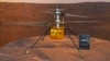 FILE - This Feb. 17, 2021, photo shows a full-scale model of the Ingenuity helicopter displayed for the media at NASA's Jet Propulsion Laboratory in Pasadena, Calif.