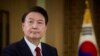 In this photo provided Feb. 7, 2024, by the South Korea Presidential Office, South Korean President Yoon Suk Yeol speaks during a pre-recorded interview with KBS television at the presidential office in Seoul, South Korea, Feb. 4, 2024.