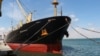 The Greek-flagged bulk cargo vessel Sea Champion is docked at the port of Aden, Yemen, where it arrived after being attacked in the Red Sea in what appeared to have been a mistaken missile strike by Houthi militia, Feb. 21, 2024.