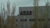 FILE - A Volkswagen factory sits on the outskirts of Urumqi in in western China's Xinjiang Uyghur Autonomous Region on April 22, 2021. 