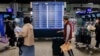 People look at flight information at Taiwan Taoyuan International Airport in Taoyuan, Taiwan, April 12, 2023.