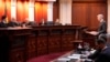 FILE - Attorney Eric Olson, far right, argues before the Colorado Supreme Court in Denver, Dec. 6, 2023. The Colorado Supreme Court on Tuesday declared Trump ineligible for the White House under the U.S. Constitution’s insurrection clause.