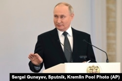 Russian President Vladimir Putin delivers a speech during a ceremony to present Gold Star medals to Heroes of Russia at the St. George Hall of the Grand Kremlin Palace in Moscow, Russia, Dec. 8, 2023.