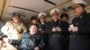 In this photo provided by the North Korean government, North Korean leader Kim Jong Un, front left, provides direction as it conducts a test firing of what it says are surface-to-sea missiles in North Korea, Feb. 14, 2024. 