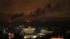A picture taken from Rafah shows smoke billowing following Israeli bombardment of Khan Yunis in the southern Gaza Strip on Dec. 9, 2023, amid continuing battles between Israel and the militant group Hamas. 