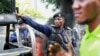 A police officer reacts during a protest near the UN mission in Congo MONUSCO headquarters in downtown Kinshasa, Democratic Republic of Congo, Feb. 12, 2024.
