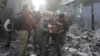 Palestinians evacuate wounded people during an Israeli bombardment of Rafah, Gaza Strip, on Dec. 1, 2023.