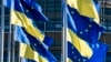 FILE - European Union and Ukraine flags fly outside the European Parliament, in Strasbourg, France, March 8, 2022.