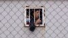 FILE - Children who crossed into Spain are seen inside a temporary shelter for unaccompanied minors in the enclave of Ceuta, next to the border of Morocco and Spain, May 20, 2021.