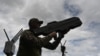 FILE - A Ukrainian serviceman tests an anti-drone gun during a presentation of radio-electronic warfare (WB) and radio-electronic intelligence (PER) systems of the Ukrainian company Kvertus in Lviv region on May 28, 2024.