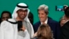 COP28 President Sultan Ahmed al-Jaber, the United Arab Emirates' special envoy for climate change, and John Kerry, U.S. special presidential envoy for climate, are pictured at the end of the COP28 U.N. Climate Summit, Dec. 13, 2023, in Dubai, UAE.