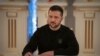 FILE - Ukrainian President Volodymyr Zelenskyy signs a document in Kyiv, Jan. 12, 2024.