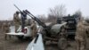 Air Defense Ukrainian servicemen, who took part in the defense operations during recent attacks on Kyiv, prepare their weapons near Kyiv on Jan. 3, 2024.