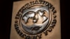 FILE - The logo of the International Monetary Fund is visible on its building in Washington, April 5, 2021. 