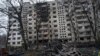 A destroyed car is seen in the yard of kindergarten after a Russian rocket attack in Kyiv, Ukraine, Dec. 13, 2023. Ukraine is working to boost its defense industry at home by signing contracts for joint cooperation on technology weapons production with Western partners. 