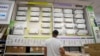 FILE - A man looks at a a wall displaying air conditioning models on sale at department store, in Rome, July 25, 2023.