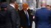 Former US President Donald Trump leaves his apartment building in New York, Jan. 25, 2024.