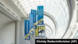 Banners advertise information about Comic-Con International in San Diego, California, July 26, 2024. (Photo by Christy Radecic/Invision via AP)