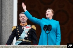 Danish Prime Minister Mette Frederiksen proclaims Denmark's King Frederik X as the new king from the balcony of Christiansborg Palace in Copenhagen, Jan. 14, 2024.