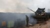 An Israeli soldier stands by a mobile artillery unit, near the Israel-Lebanon border, in northern Israel, Jan. 15, 2024.