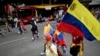 A woman holds a Venezuelan flag during a protest against the result announced for the Venezuelan presidential election at the Reforma Avenue in Mexico City on Aug. 10, 2024. 