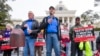 Former death row inmates who were exonerated, from left, Randall Padgent, Gary Drinkard and Ron Wright, were among the protestors gathered at Alabama's capitol, on Jan. 23, 2024, to ask the governor to stop the execution of Kenneth Eugene Smith. 