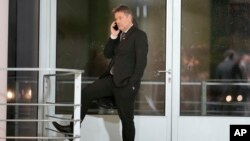 FILE - Robert Habeck, German Vice Chancellor and Federal Minister for Economic Affairs and Climate Action makes a phone call at the chancellery in Berlin, Germany, on Nov. 22, 2023. 