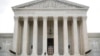 FILE - A police officer guards the main entrance to the Supreme Court in Washington, Oct. 9, 2018.