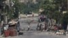 FILE - Armed gang members walk through the streets in Port-au-Prince, Haiti, April 23, 2024. 