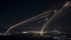 The Israeli Iron Dome air defense system fires profectiles to intercept an attack from Lebanon over the Galilee region as seen from the Israeli-annexed Golan Heights, Aug. 4, 2024. 