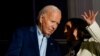 Vice President Kamala Harris speaks with President Joe Biden on a White House balcony during an Independence Day celebration in Washington, July 4, 2024. 