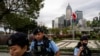 Police officers stand guard outside the Legislative Council in Hong Kong, March 19, 2024. 