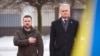 In this photo provided by the Ukrainian Presidential Press Office, Lithuania's President Gitanas Nauseda, right, and Ukrainian President Volodymyr Zelenskyy attend a ceremony in Vilnius, Lithuania, Jan. 10, 2024. (Ukrainian Presidential Press Office via AP)