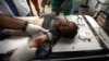 A Palestinian child wounded in the Israeli bombardment of the Gaza Strip receives treatment at the Nasser hospital in Khan Younis, southern Gaza Strip, Dec. 29, 2023. 
