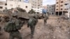 FILE - Israeli soldiers take part in a ground operation in Gaza City's Shijaiyah neighborhood, Dec. 8, 2023. U.S. Secretary of State Antony Blinken has approved an emergency weapons sale to Israel as Israel continues its war against Hamas in Gaza. 