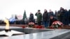 FILE - Mourners gather to lay flowers in memory of more than 60 Russian soldiers that Russia says were killed in a Ukrainian strike on Russian-controlled territory, in Samara, on Jan. 3, 2023. 