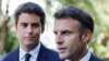 FILE - French Education and Youth Minister Gabriel Attal (L) looks at France's President Emmanuel Macron addressing the audience at a vocational school in Orange, Southeastern France, Sept. 1, 2023. 