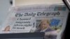 FILE - Copies of The Daily Telegraph are displayed on a rack in a London supermarket, Jan. 20, 2024. 