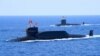 Kapal selam Tipe 094A Jin milik Tentara China yang dilengkapi denga rudal balistik, terlihat dalam pertunjukkan militer di Laut China Selatan, pada 12 April 2018. (Foto: Reuters/Stringer)