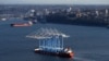FILE - The Zhen Hua 31 heavy-lift ship carries four super-post Panamax container cranes into Commencement Bay, in Tacoma, Washington, March 5, 2019. The cranes were purchased by from Shanghai Zhenhua Heavy Industries Co. Ltd. in China.
