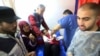 Palestinian medics treat a girl wounded in the Israeli bombardment at a building of an UNRWA vocational training center which displaced people use as a shelter in Khan Younis, southern Gaza Strip, Jan. 24, 2024.