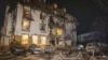 FILE - In this photo provided by the Ukrainian Emergency Service, firefighters examine the site of Russia's missile attack that hit a hotel in Kharkiv, Ukraine, late Jan. 10, 2024. (Ukrainian Emergency Service via AP)