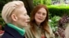This image released by Sony Pictures Classics shows Julianne Moore, right, and Tilda Swinton in a scene from "The Room Next Door." It's the first full-length film in English for Spain's Pedro Almodovar.