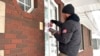 Drew Klein, a senior adviser with AFP Action, a group that has endorsed Nikki Haley, knocks on doors, Jan. 13, 2024, in Urbandale, Iowa.