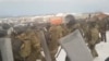 Riot police disperse a rally in support of Fail Alsynov, who was charged with inciting ethnic hatred and sentenced to four years in a prison colony, in Baymak in the republic of Bashkortostan, Russia, in this still from a Jan. 17, 2024, video.