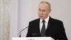 Russian President Vladimir Putin delivers a speech at the St. George Hall of the Grand Kremlin Palace in Moscow, Dec. 8, 2023. The announcement comes a day after lawmakers set the election date.