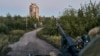 FILE - A Ukrainian soldier sits in his position in Avdiivka, Donetsk region, Ukraine, Aug. 18, 2023. 